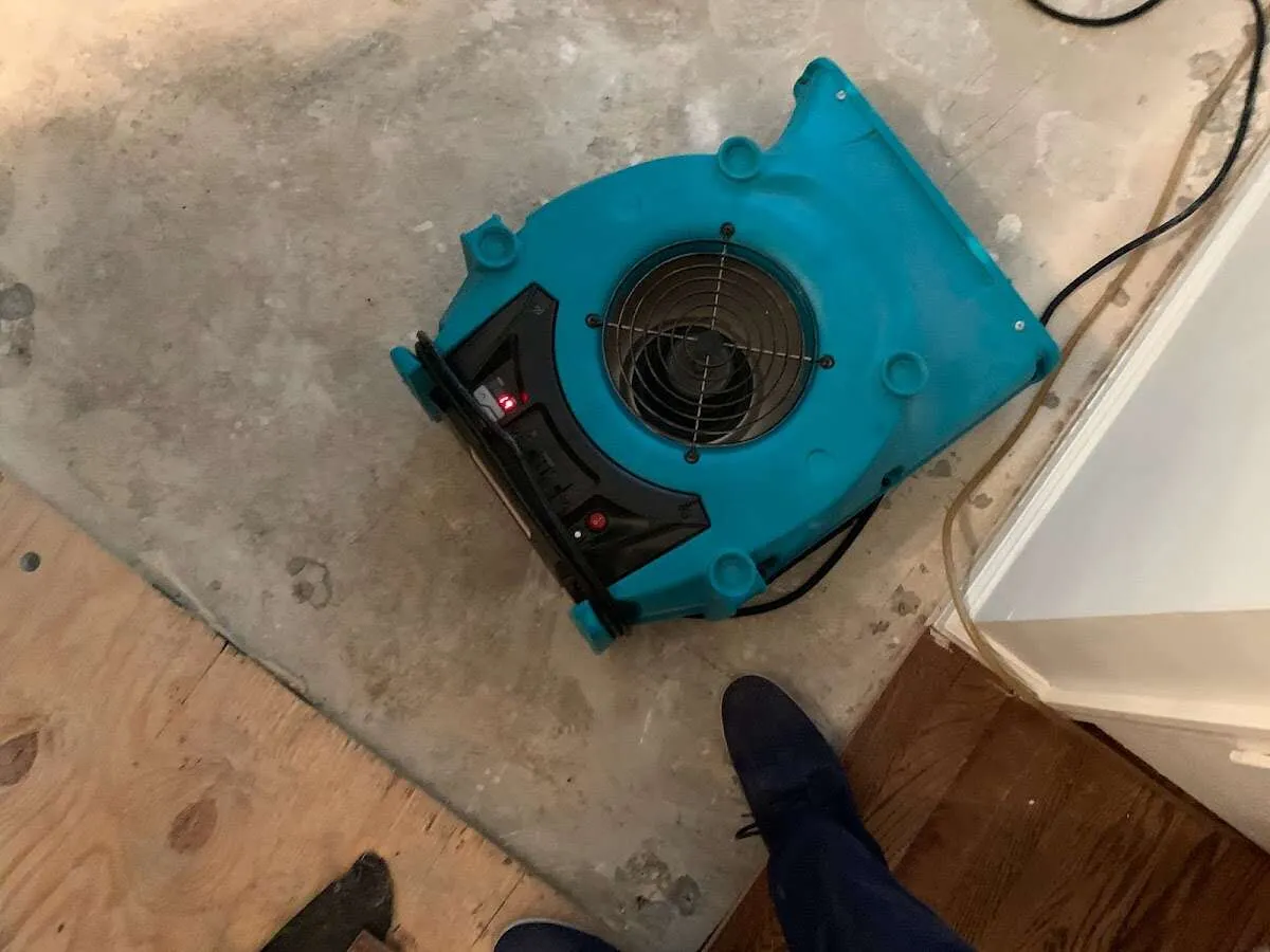 Air mover drying subfloor during Commercial Water Damage Restoration in Upper Arlington